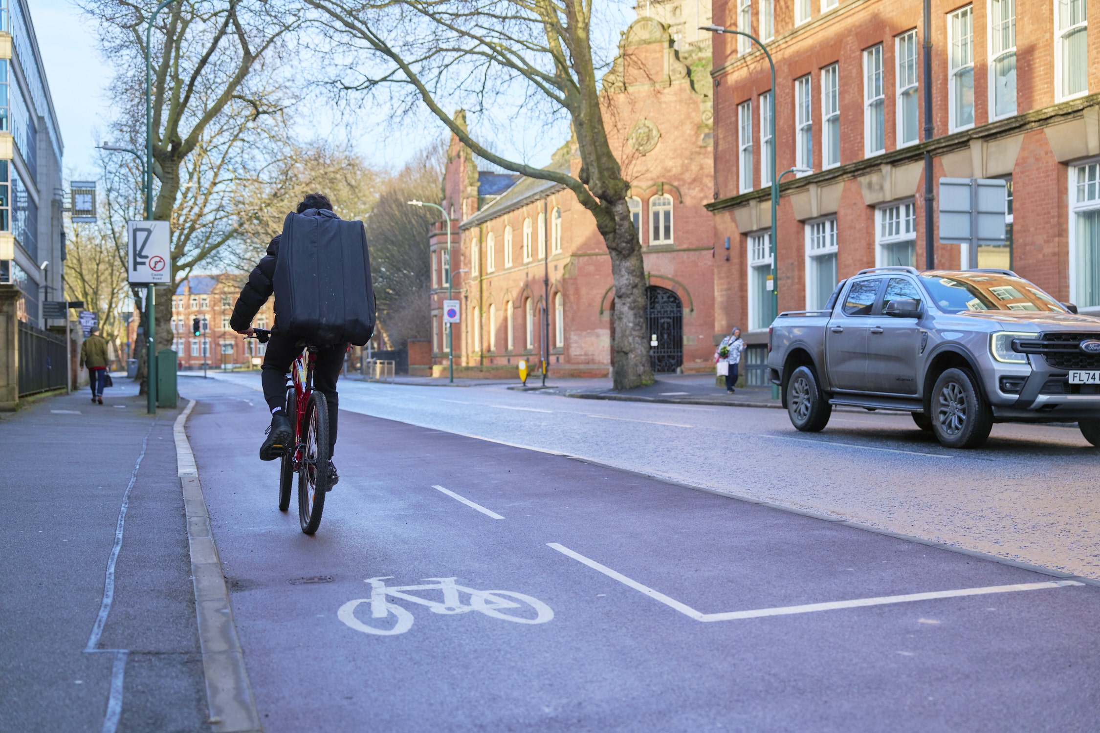 Active travel: man cycling through Nottingham