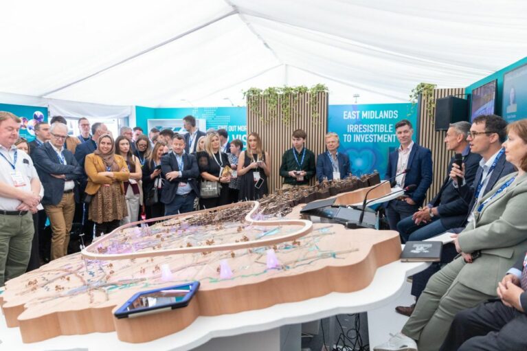 Mayor Claire Ward presents the East Midlands Vision for Growth in front of a 3D model of the region