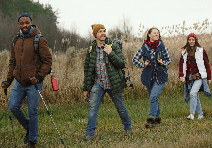 Friends hiking in a field