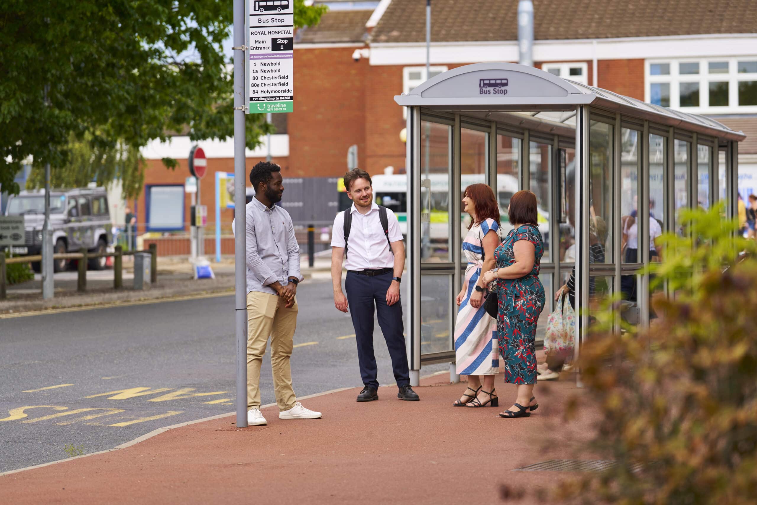 Transport Summit conference: image shows three people stood at a bus stop