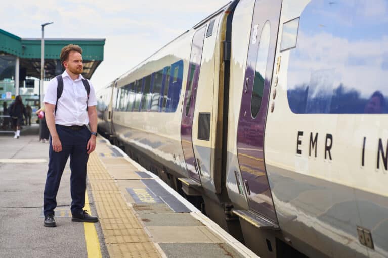Trialling the new ticketing system: a man waits for a train on the platform.