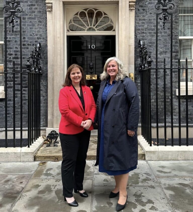 Myaor of the East Midlands stood next to the Transport Secretary Heidi Alexander. Both are stood outside the black door of Number 10 Downing Street in London.