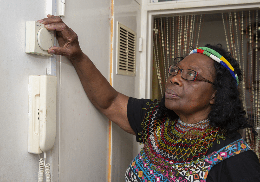 Retrofit &#8211; lady using thermostat