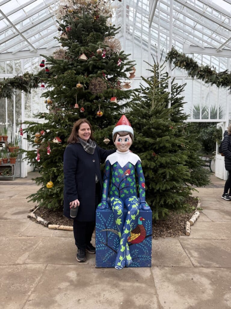 Mayor Claire Ward with an Elf on the Shelf sculpture at Clumber Park.