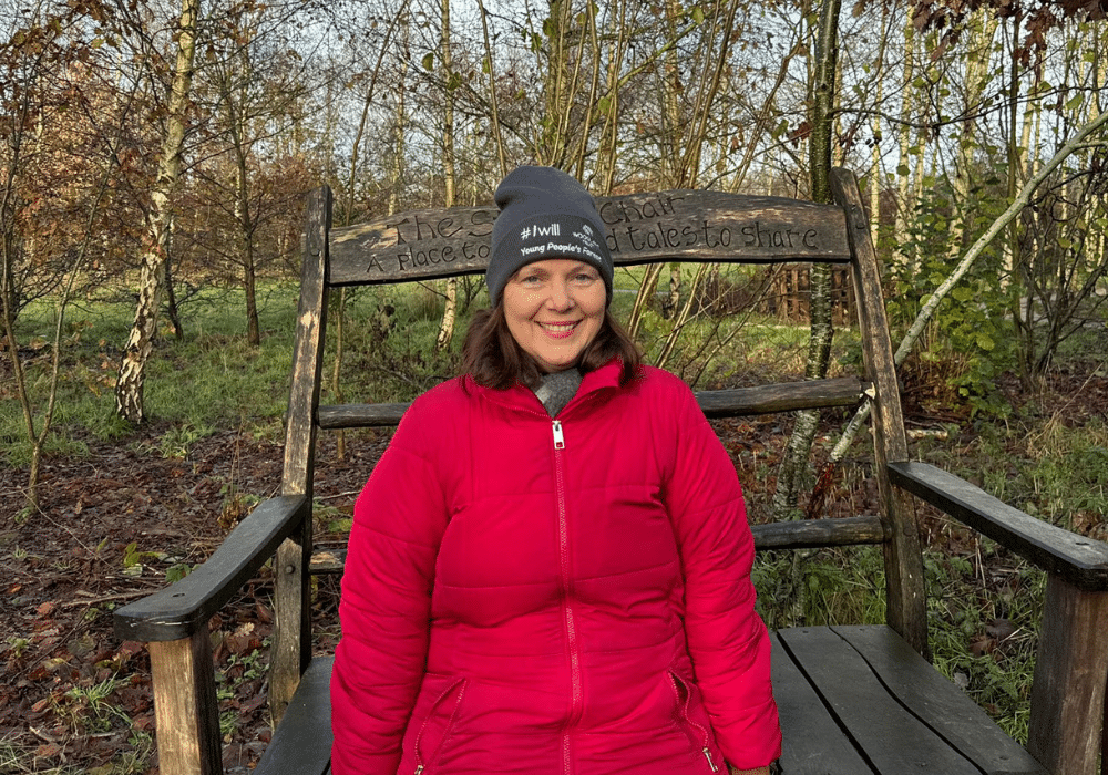 Mayor Claire sits on a commemorative bench at the Young People's Forest near Heanor