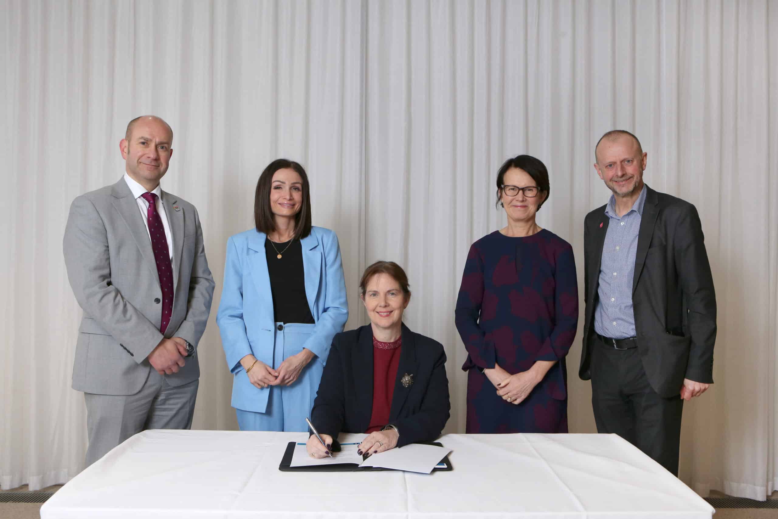 Mayor Claire Ward signs the University Compact, flanked by, from left, Prof Keith McLay, University of Derby deputy Vice Chancellor, EMCCA chief executive Amy Harhoff, University of Nottingham Vice Chancellor Prof Jane Norman and Nottingham Trent University Vice Chancellor Prof Dave Petley.