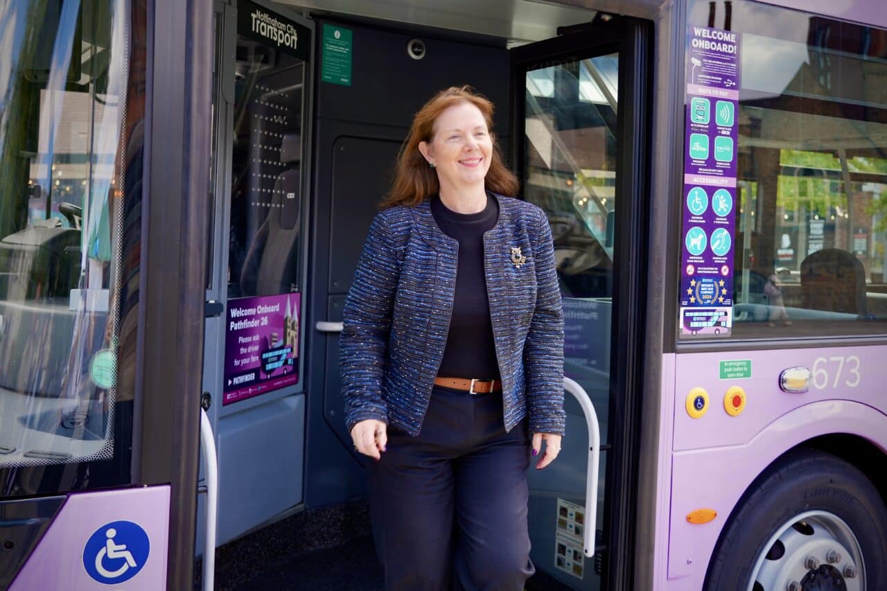 Mayor Claire Ward alights from a bus
