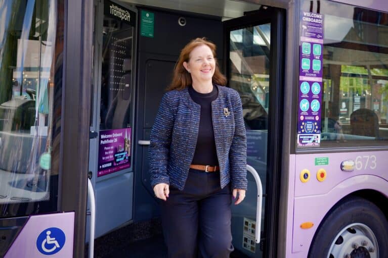 Mayor Claire Ward alights from a bus